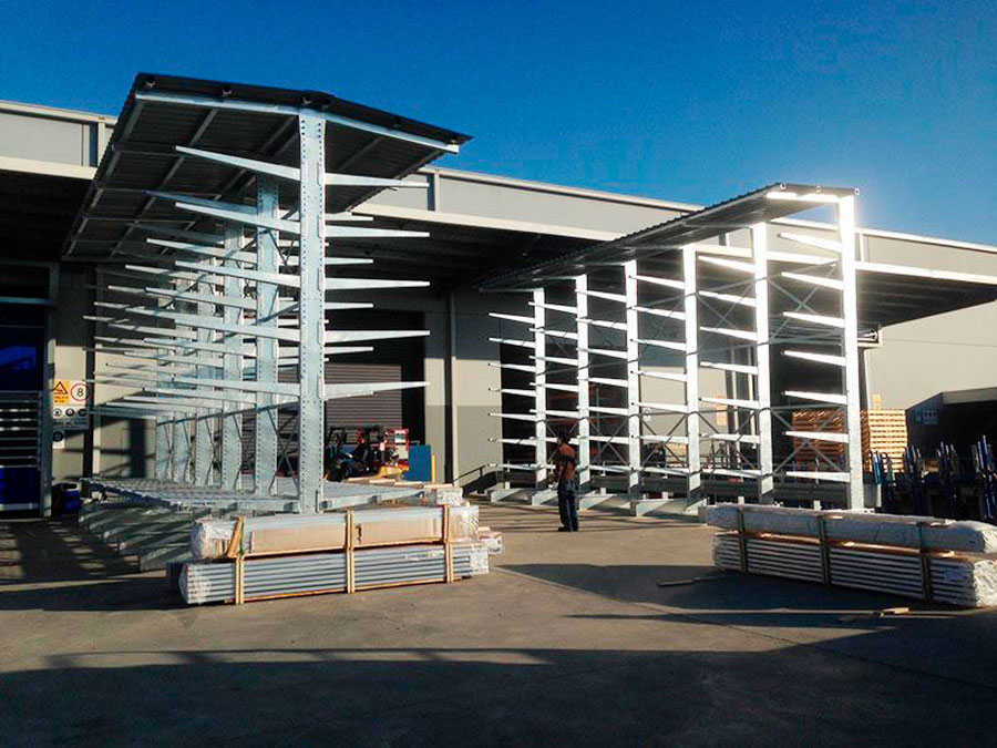 Cantilever System with built in roof system to protect material in outdoor environment