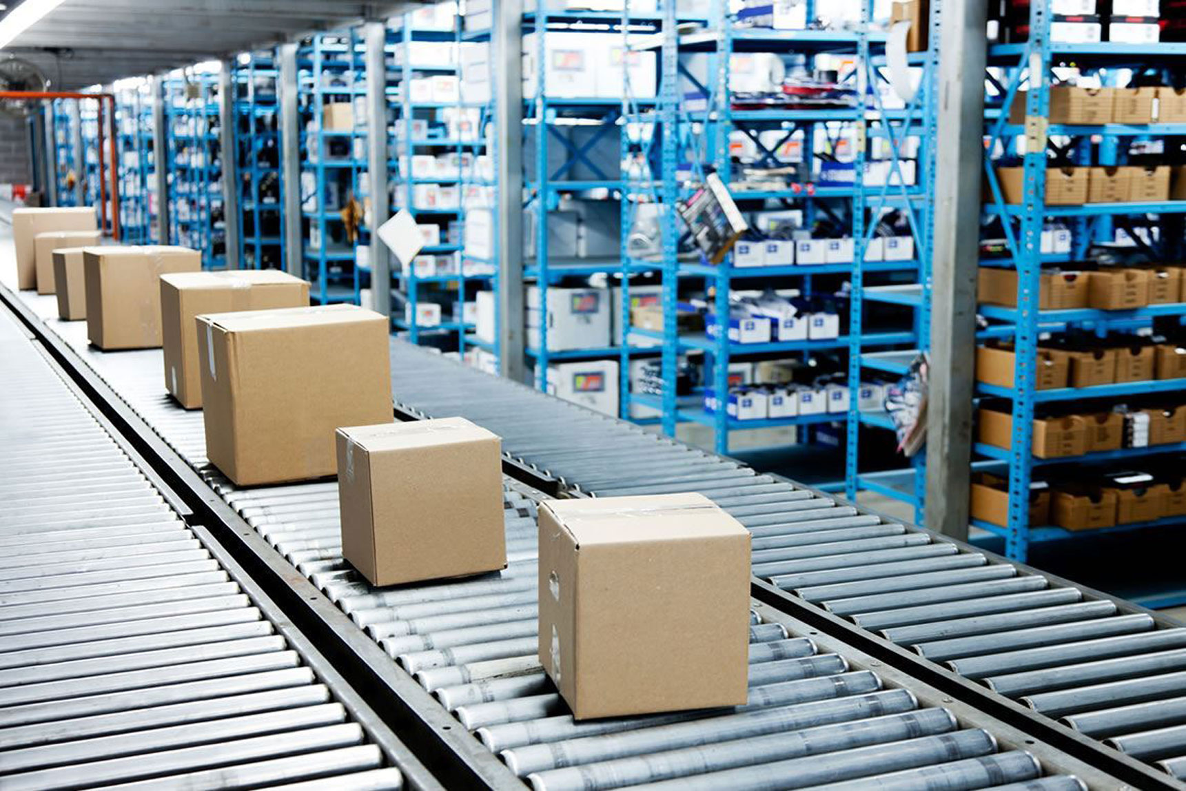 Emrack Conveyor system used for boxed stock in face paced warehouse environment